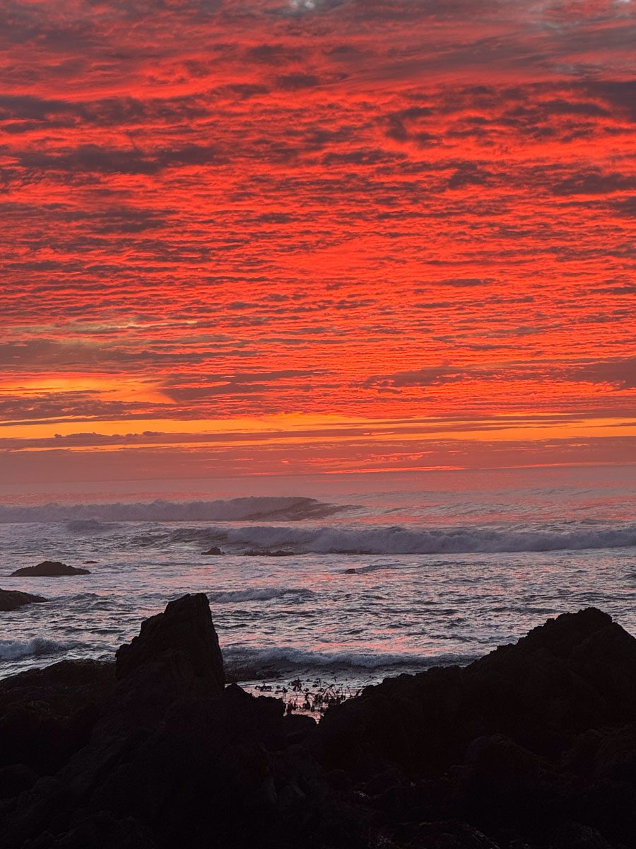 A deep red sunset burning over the Pacific